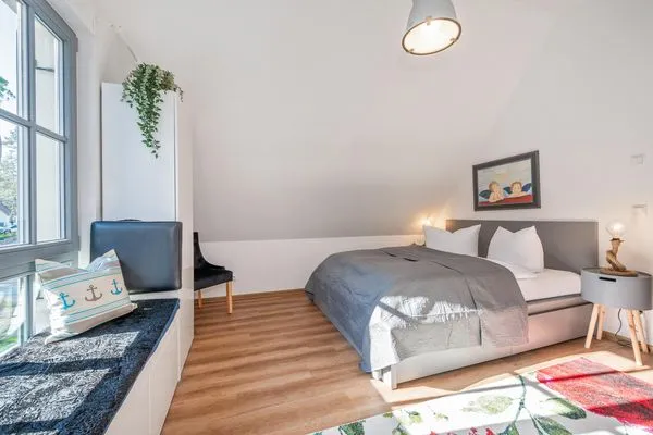 Schlafzimmer  Ferienhaus Auszeitfischer mit Sauna, Kamin und Terrasse