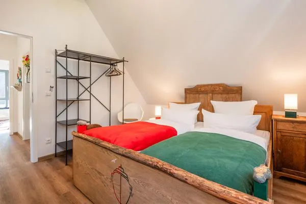Schlafzimmer  Ferienhaus Auszeitfischer mit Sauna, Kamin und Terrasse