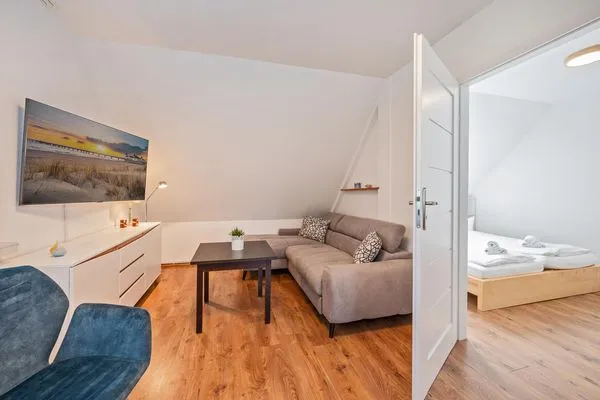 Wohnzimmer  Ferienwohnung Am Bahnhof mit 2 Bädern und nur 700 m zum Strand