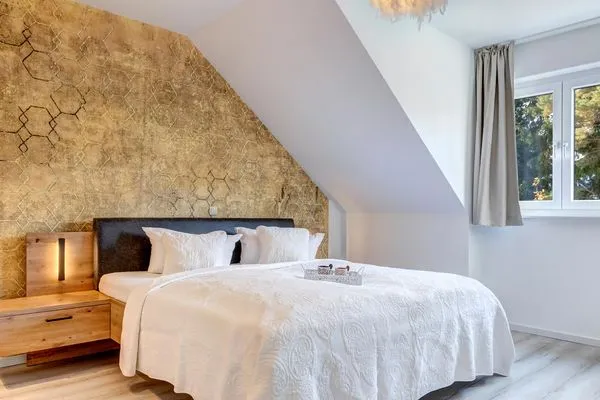Schlafzimmer  Ferienwohnung Ostseenest Bernstein mit Terrasse & nur 800 m zum Strand