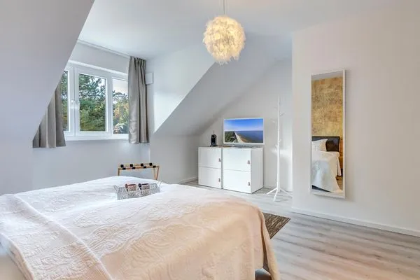 Schlafzimmer  Ferienwohnung Ostseenest Bernstein mit Terrasse & nur 800 m zum Strand