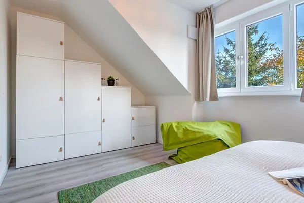 Schlafzimmer  Ferienwohnung Ostseenest Bernstein mit Terrasse & nur 800 m zum Strand