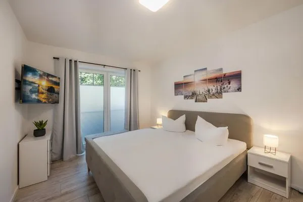 Schlafzimmer  Ferienwohnung Achterliek nur 300 m zum Strand mit Balkon
