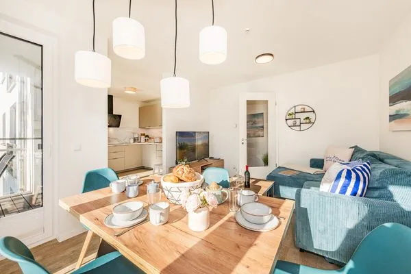 Wohnzimmer  Ferienwohnung Haff & Herz mit Balkon, Freizeit- und Kinderspielbereich