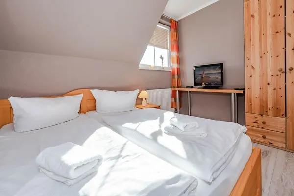 Schlafzimmer  Ferienhaus Golfblick mit Sonnenterrasse und Kamin