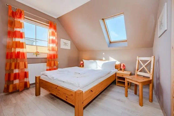 Schlafzimmer  Ferienhaus Golfblick mit Sonnenterrasse und Kamin