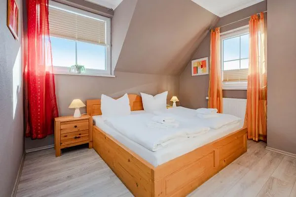Schlafzimmer  Ferienhaus Golfblick mit Sonnenterrasse und Kamin