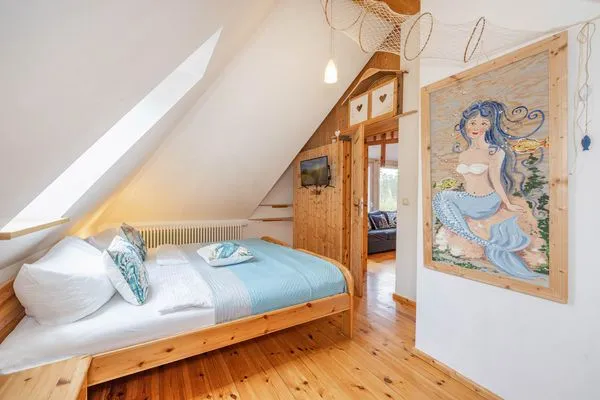 Schlafzimmer  Ferienhaus Rad Kapitän direkt am See mit Sauna und Terrasse