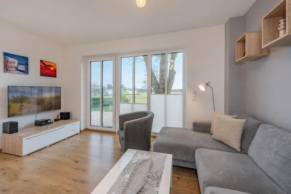Wohnzimmer  Ferienhaus Anemone mit Kamin und großer Sonnenterrasse