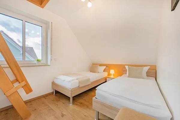 Schlafzimmer  Ferienhaus Anemone mit Kamin und großer Sonnenterrasse