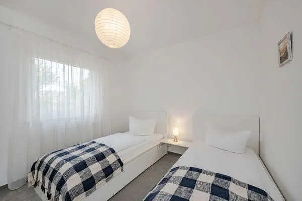 Schlafzimmer  Ferienwohnung Gestrandet mit Terrasse, Parkplatz und WLAN