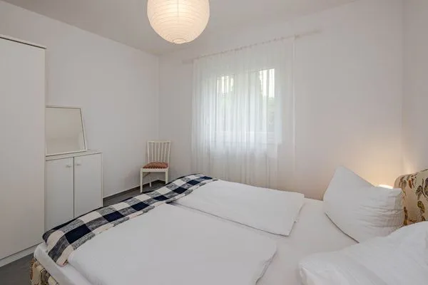 Schlafzimmer  Ferienwohnung Gestrandet mit Terrasse, Parkplatz und WLAN
