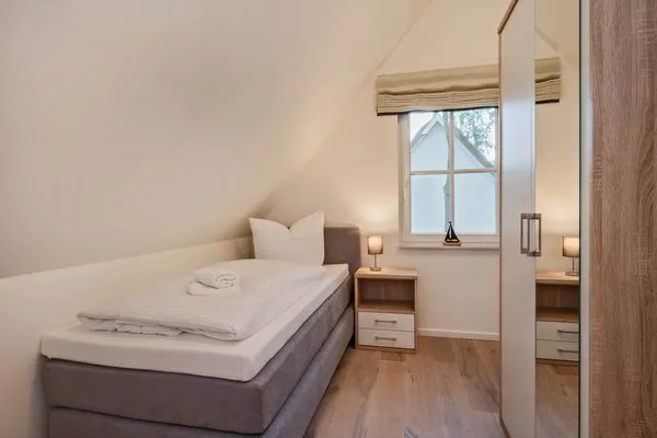 Schlafzimmer  Ferienhaus Im Kiefernwäldchen mit Sauna, Kamin und Terrasse