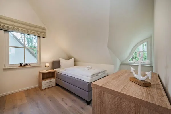 Schlafzimmer  Ferienhaus Im Kiefernwäldchen mit Sauna, Kamin und Terrasse