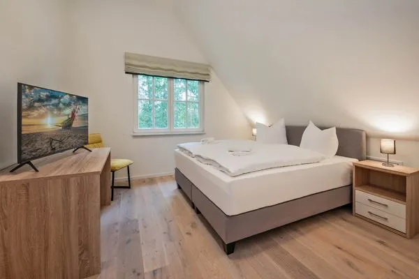 Schlafzimmer  Ferienhaus Im Kiefernwäldchen mit Sauna, Kamin und Terrasse
