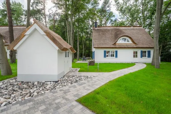 Fassade / Eingang  Ferienhaus Im Kiefernwäldchen mit Sauna, Kamin und Terrasse