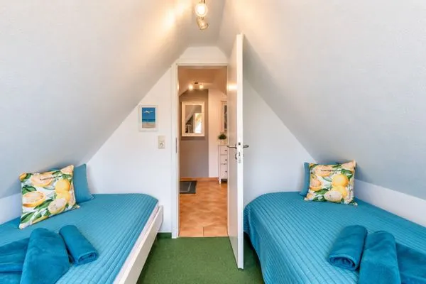 Schlafzimmer mit zwei Einzelbetten  Ferienwohnung Jonathan
