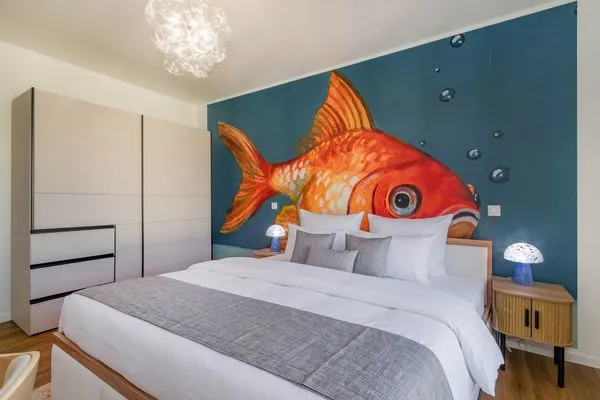Schlafzimmer  Ferienwohnung Goldfisch mit Balkon, Wellness- und Kinderspielbereich