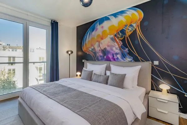 Schlafzimmer  Ferienwohnung Goldfisch mit Balkon, Wellness- und Kinderspielbereich