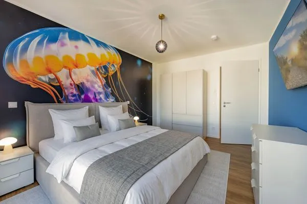 Schlafzimmer  Ferienwohnung Goldfisch mit Balkon, Wellness- und Kinderspielbereich