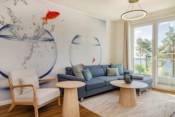 Wohnzimmer  Ferienwohnung Goldfisch mit Balkon, Wellness- und Kinderspielbereich