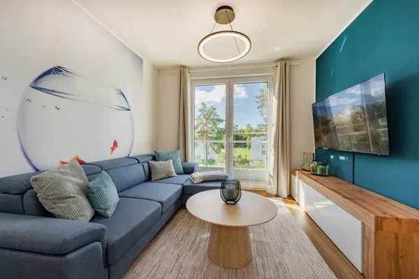 Wohnzimmer  Ferienwohnung Goldfisch mit Balkon, Wellness- und Kinderspielbereich