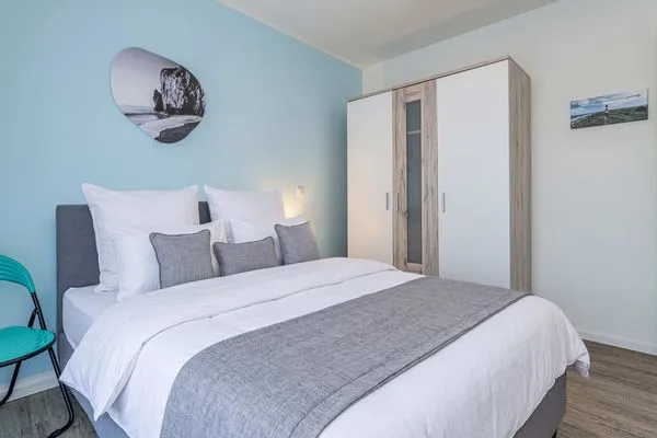 Schlafzimmer  Ferienwohnung Klippenblick mit Sauna, Kinderspielbereich und Fitnessraum
