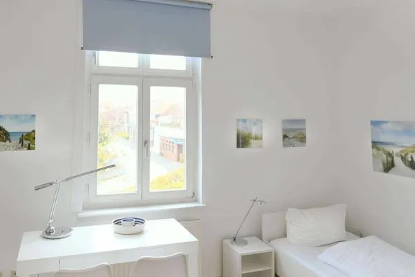 Schlafzimmer Logirhaus Doyen Ferienwohnung Robbenplate