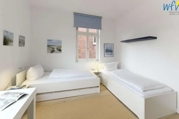 Schlafzimmer Logirhaus Doyen Ferienwohnung Robbenplate