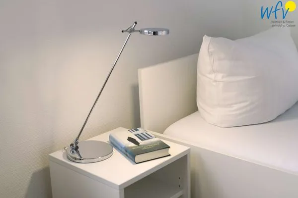 Schlafzimmer Logirhaus Doyen Ferienwohnung Robbenplate