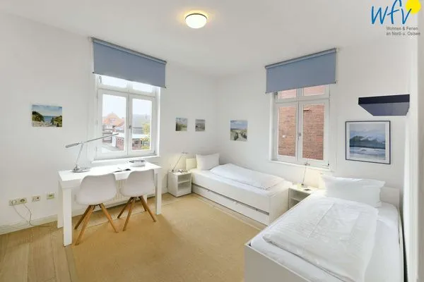 Schlafzimmer Logirhaus Doyen Ferienwohnung Robbenplate