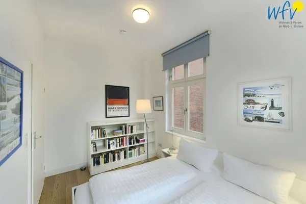 Schlafzimmer Logirhaus Doyen Ferienwohnung Robbenplate