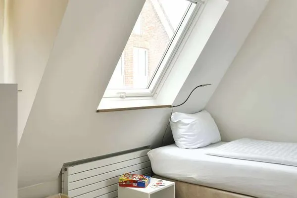 Schlafzimmer Haus Nordland Ferienwohnung Gartenblick