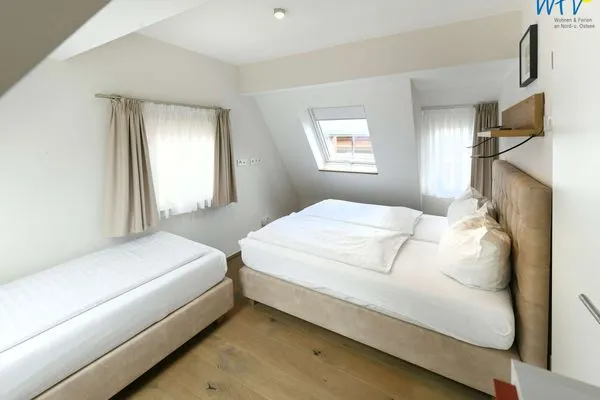 Schlafzimmer Haus Nordland Ferienwohnung Gartenblick