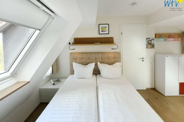 Schlafzimmer Haus Nordland Ferienwohnung Gartenblick