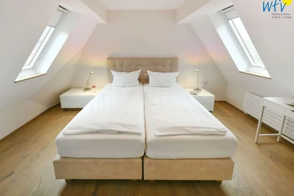 Schlafzimmer Haus Nordland Ferienwohnung Gartenblick