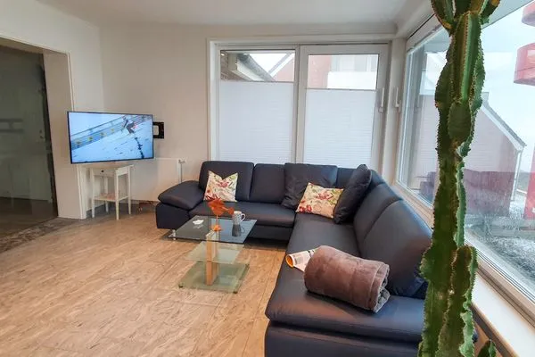 Wohnzimmer mit Kaminofen in der Ferienwohnung Gorch Fock im Haus Kap Horn in Wittdün auf Amrum Haus Kap Hoorn Ferienwohnung Gorch Fock