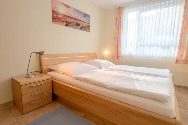 Schalfzimmer mit Doppelbett Residenz am Strand Wohnung 2-33