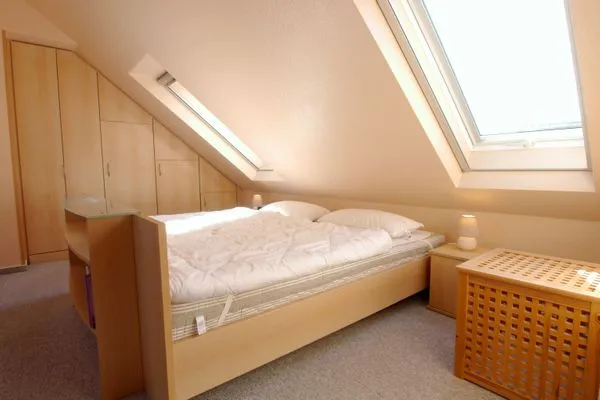 Schlafzimmer mit Doppelbett Residenz am Strand Wohnung 3-54