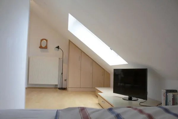 Schlafbereich im DG mit TV Residenz am Strand Wohnung 4-64