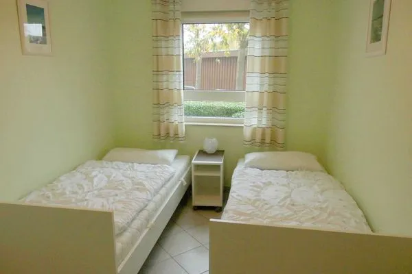 Schlafzimmer mit Einzelbetten Residenz am Strand Wohnung 6-74
