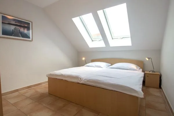 Schlafzimmer mit Doppelbett Residenz am Strand Wohnung 6-82