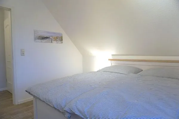 Schlafzimmer mit Doppelbett Zur Hanse Wohnung 1.4