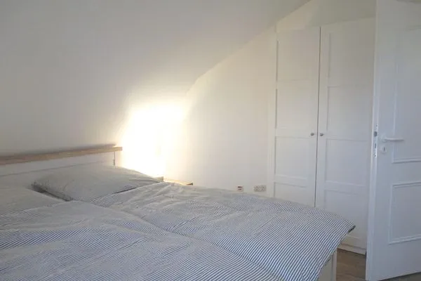 Schlafzimmer mit Doppelbett Zur Hanse Wohnung 1.4
