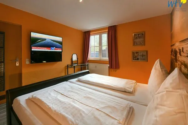 Schlafzimmer Haus Dünenrose Ferienwohnung Klabautermann