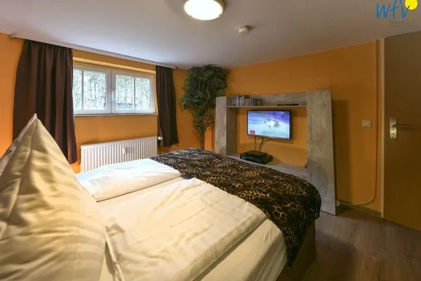 Schlafzimmer Haus Dünenrose Ferienwohnung Klabautermann