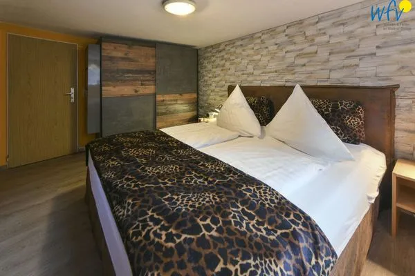 Schlafzimmer Haus Dünenrose Ferienwohnung Klabautermann