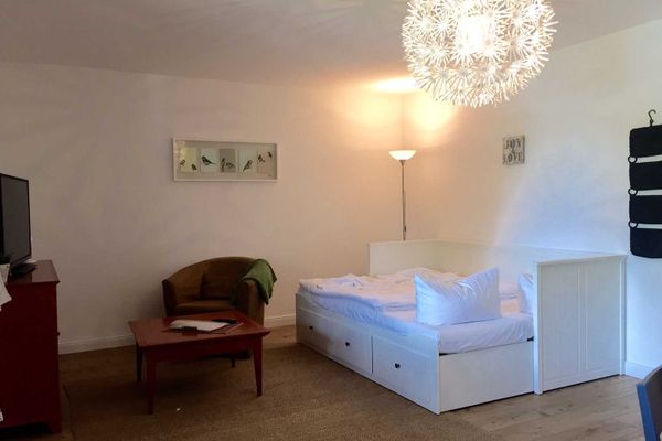 Wohnzimmer mit Schlafsofa