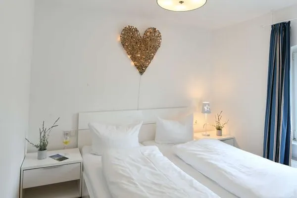 Schlafzimmer Haus Inselrose Ferienwohnung Sandröschen