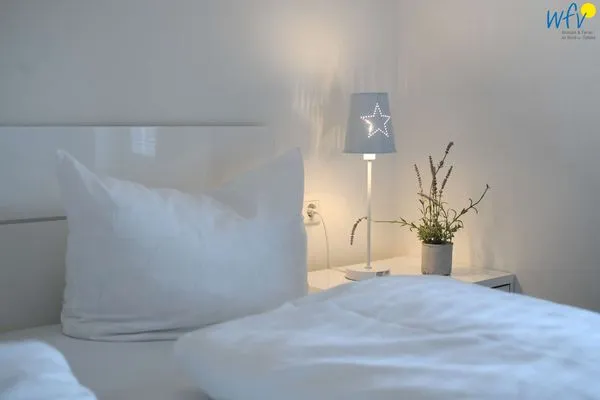 Schlafzimmer Haus Inselrose Ferienwohnung Sandröschen